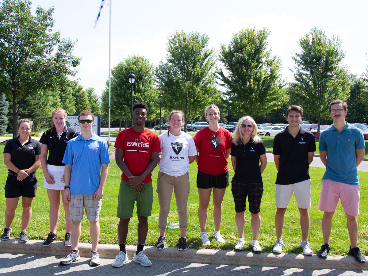 Volunteers line up as participants in Carleton's 13th annual President’s Golf Tournament teed off Aug. 20 at Stonebridge Golf Club, raising $140,000 for student athletes.