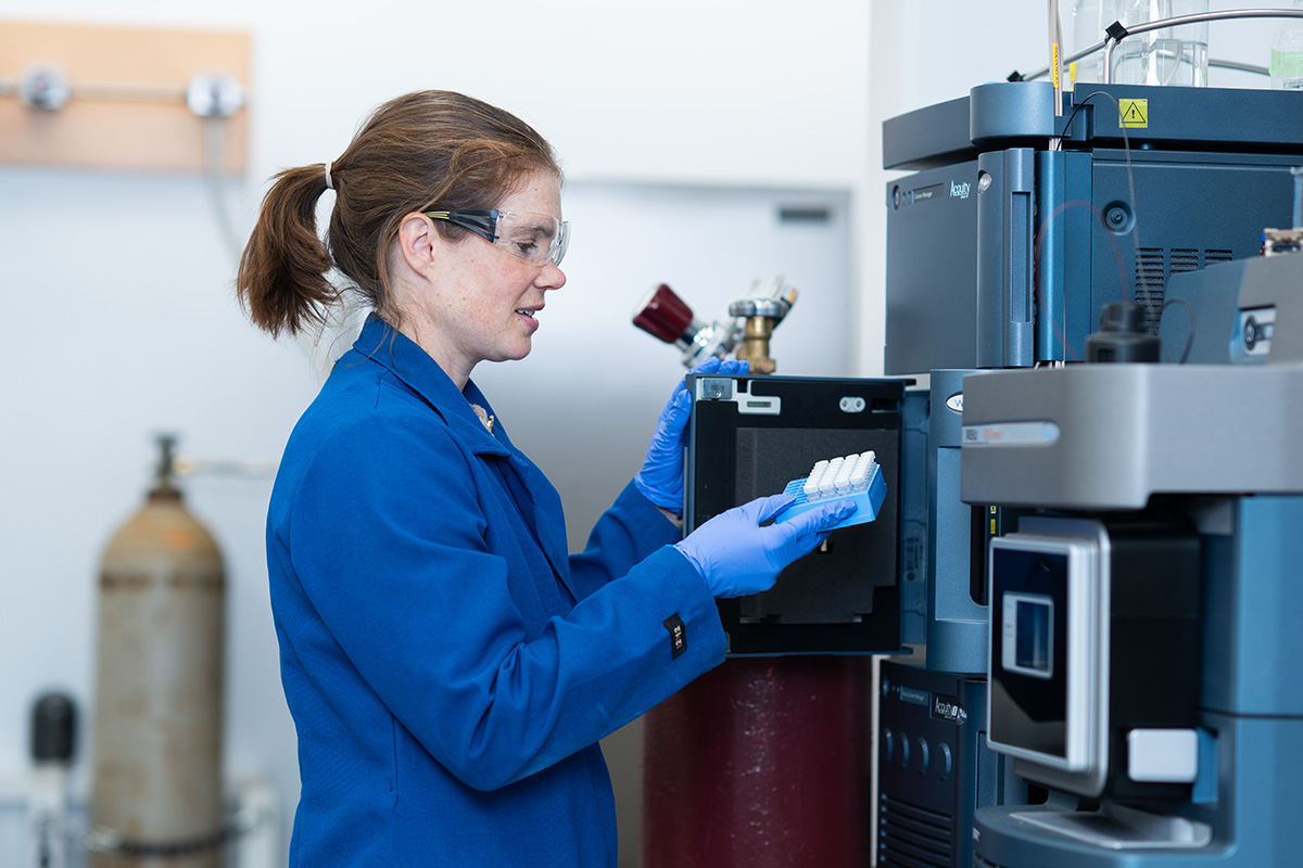 A female scientist running an experiment with forever chemicals.