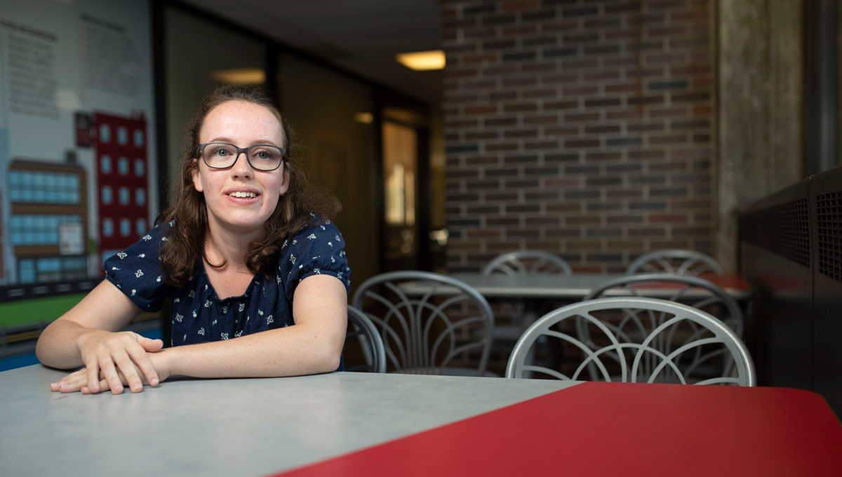 Hannah MacLellan at a table inside the University Centre. Hannah has accomplished a lot at the age of 19 and she’s just getting started in her life-long quest for disability rights.