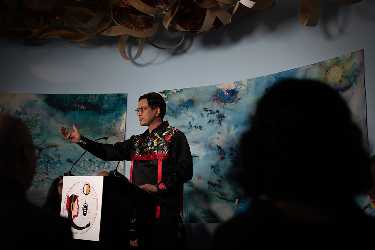 A man delivers a speech at a podium.