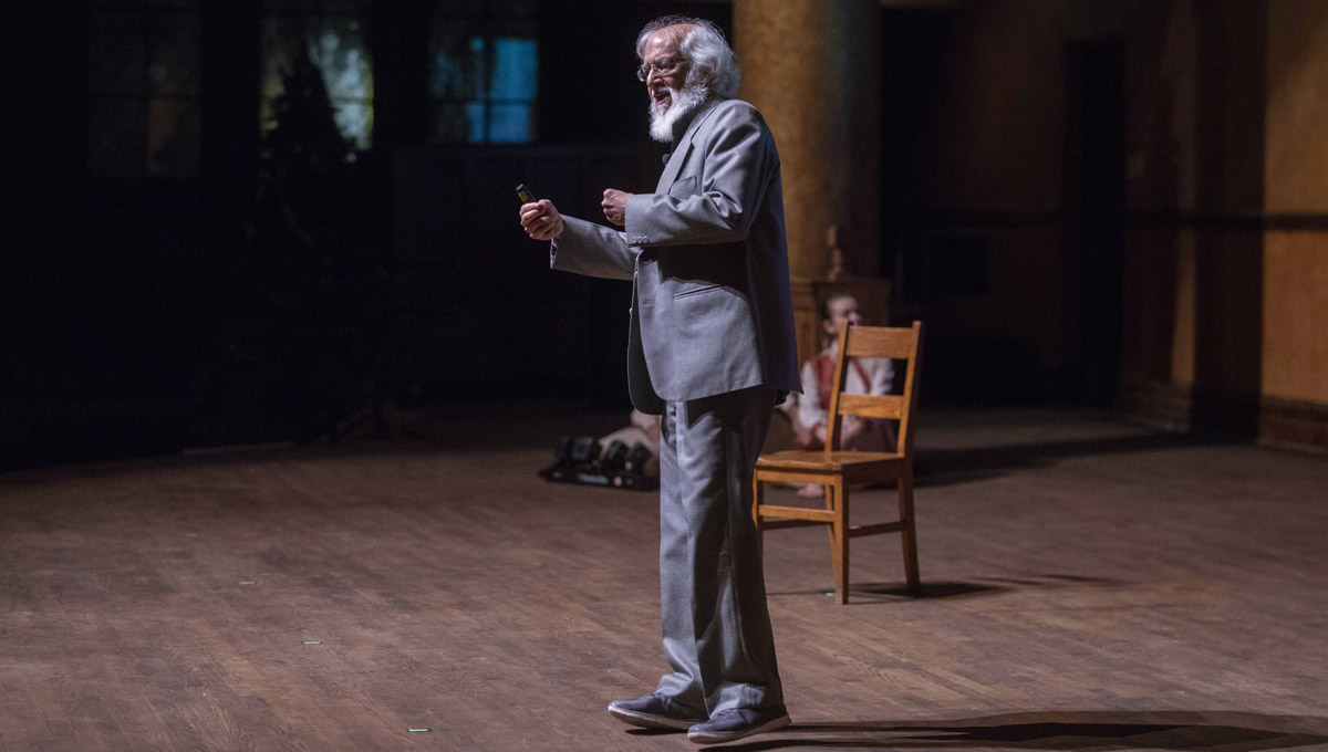 Prof. H. Masud Taj speaks at on-stage at the Dominion-Chalmers Centre.