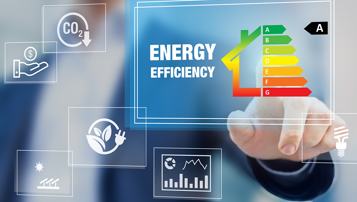 A finger touches the top of an energy efficiency meter