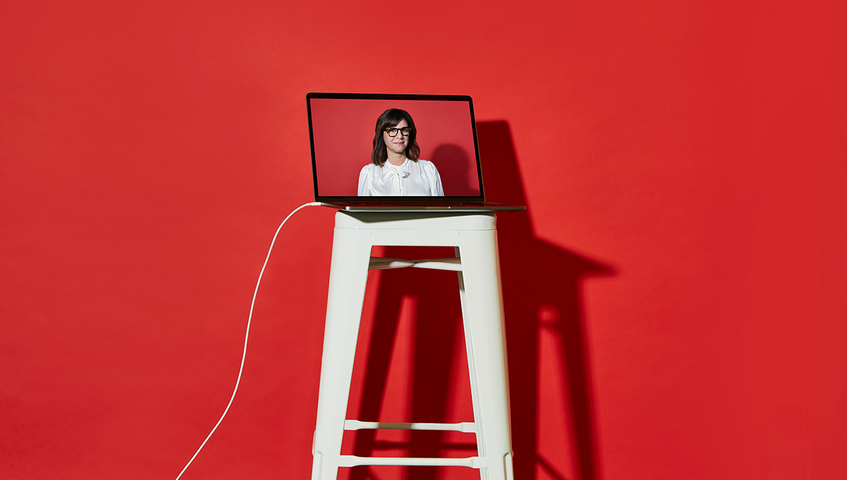 Prof. Melanie Adrian appears on a laptop screen