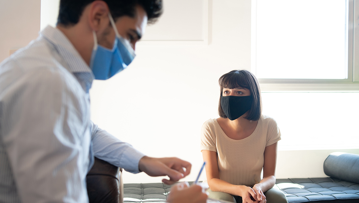 Close-up of a psychologist taking notes on clipboard during therapy session with his patient. (Photo: iStockPhoto)