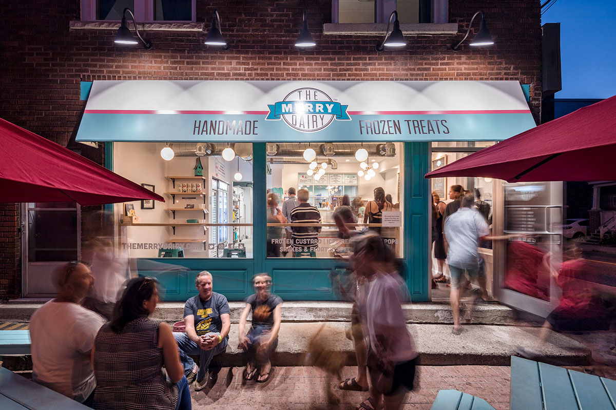 People gathering outside of a store front, as an other example of locally created gifting ideas.