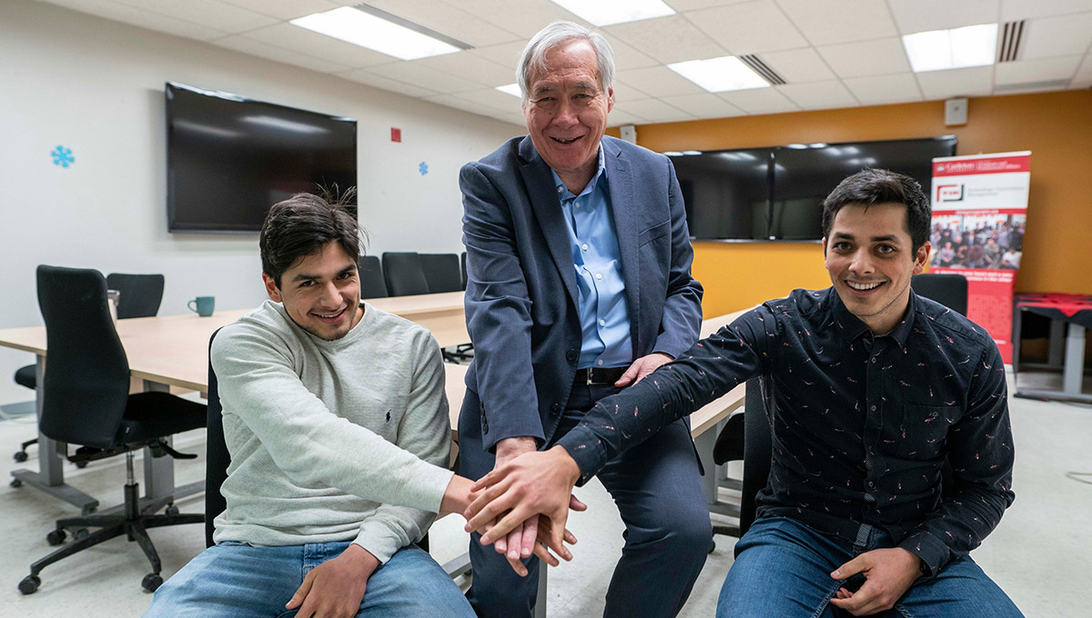 Photo of Prof. Tony Bailetti (middle) with Carleton University business students