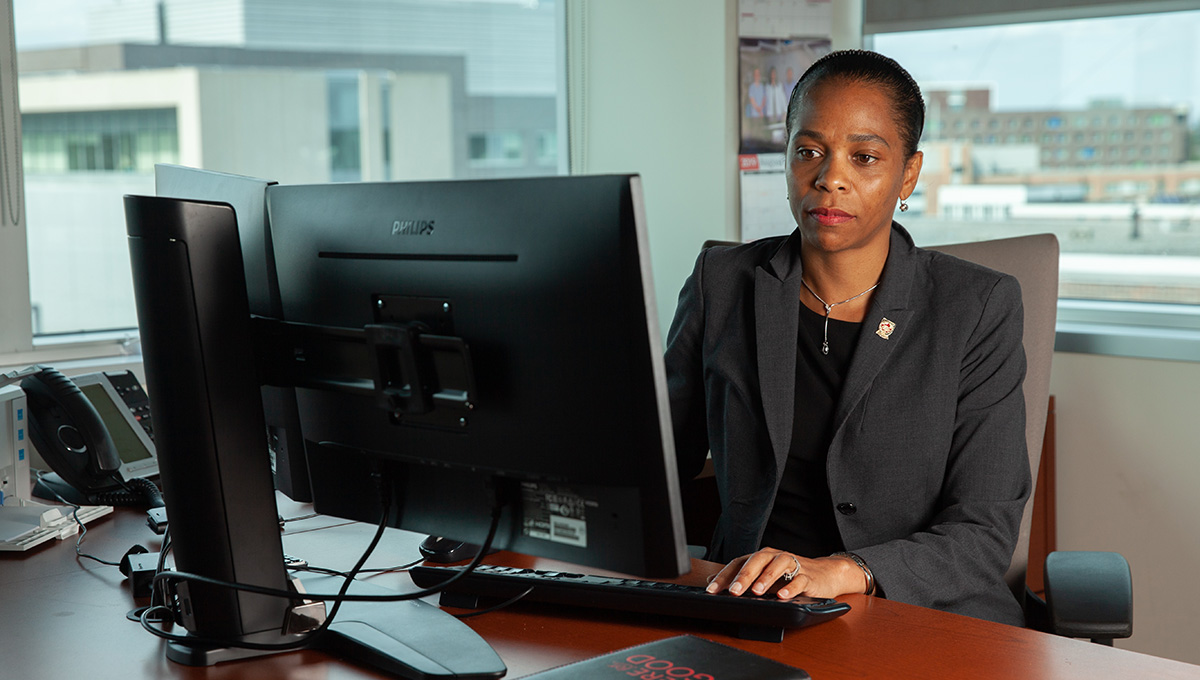 Patrice Smith, Dean of the Faculty of Graduate and Postdoctoral Affairs, working at her desk.