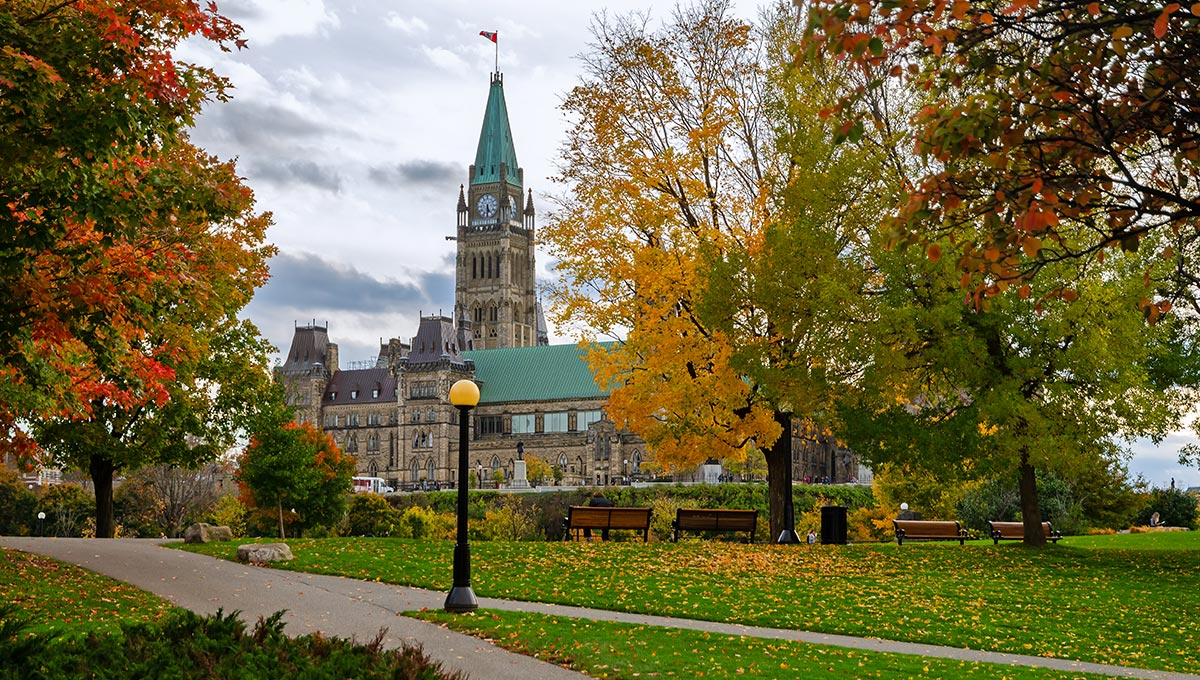 Canadian Parliament Buildings in autumn seen from Major's Hill Park in Ottawa, Canada