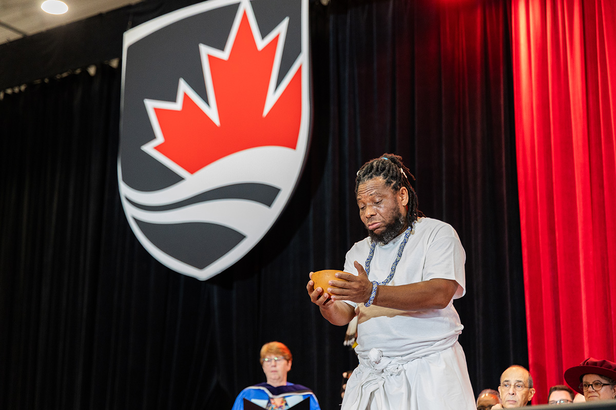 A man performs a traditional libation ceremony.