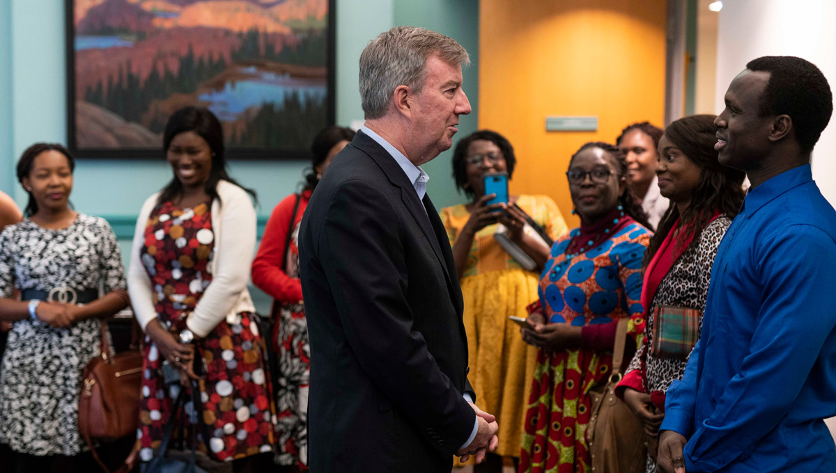 Mayor Jim Watson greets one of Carleton’s visiting Queen Elizabeth Scholarship- Advanced Scholars at City Hall.