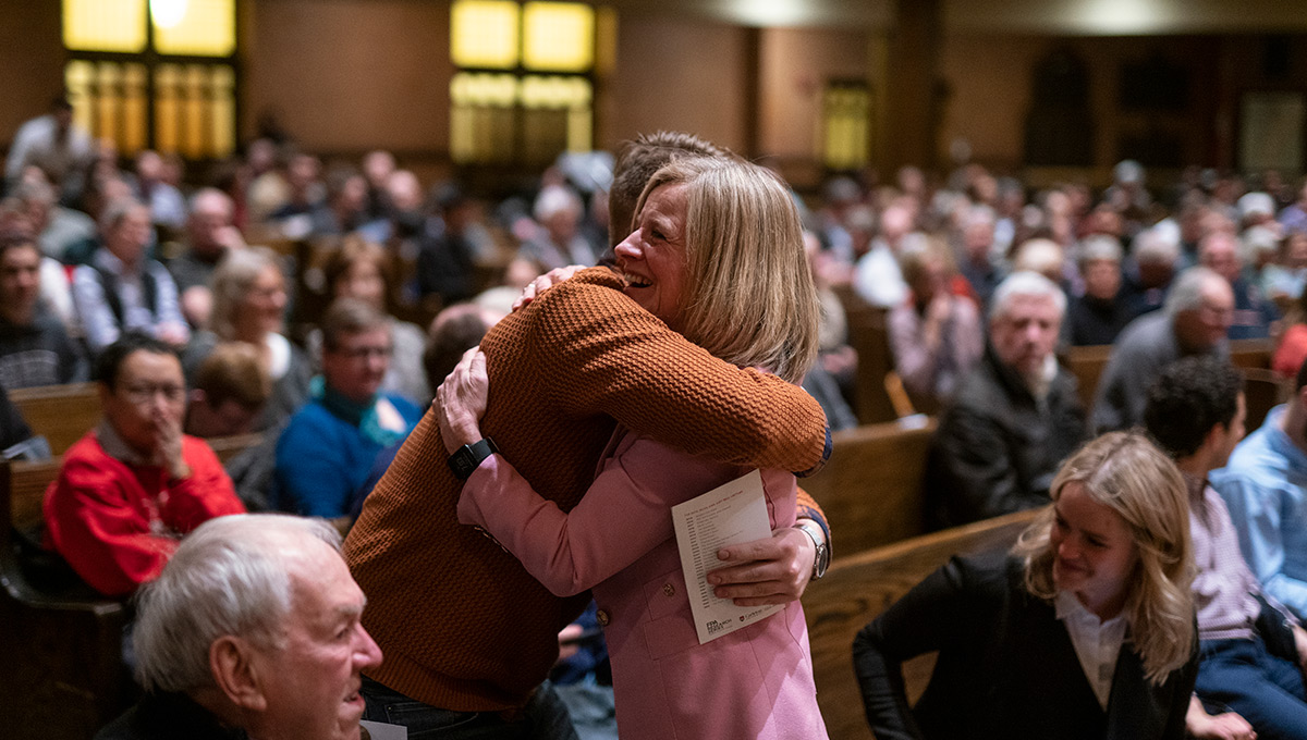 Rachel Notley hugs a member of the audience