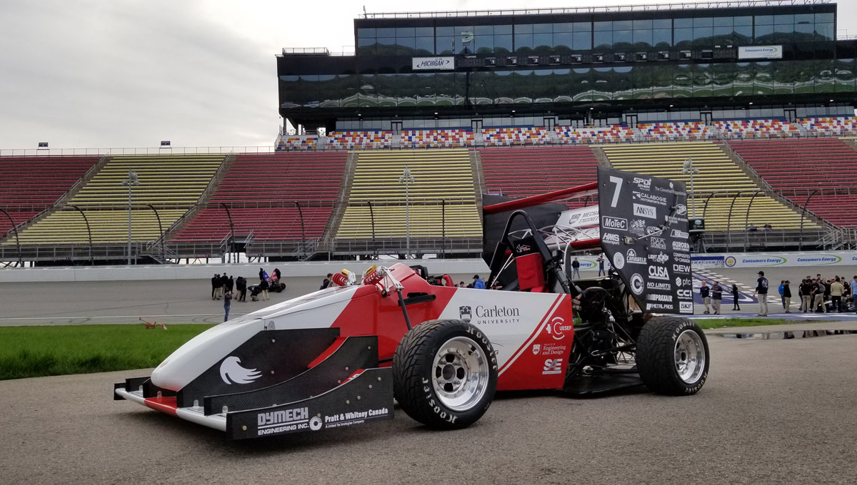 The Carleton University Ravens Racing team, whose care is pictured here at a race track, came in sixth place at the Formula SAE Michigan competition in 2019.