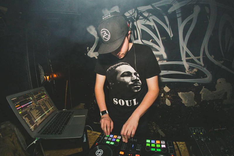 Photo of Nicholas Osborne working as a DJ in a nightclub