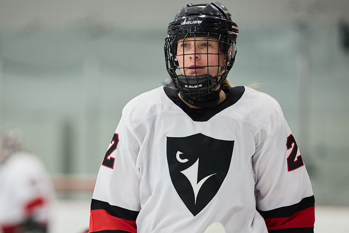 A close up of a hockey player, used as an example of how Carleton Ravens women are excelling in their respective athletic programs.