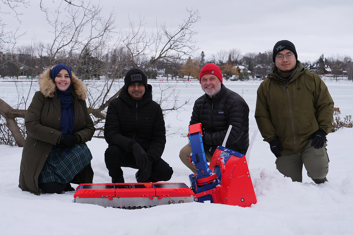 A team of researchers on the Rideau Canal Skateway to show off their snow-clearing robot.