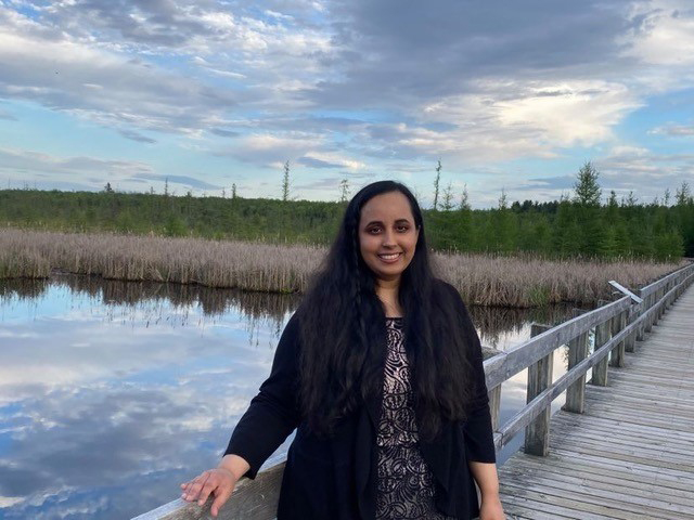 Sana Maqsood standing on a pier