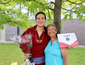 A Carleton University graduate celebrating with a parent at Spring Convocation 2024