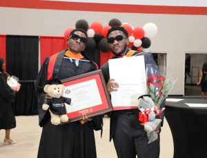 Two friends celebrate their graduation at Spring Convocation 2024