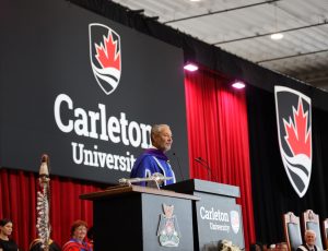 A speech is delivered from a podium at Spring Convocation 2024