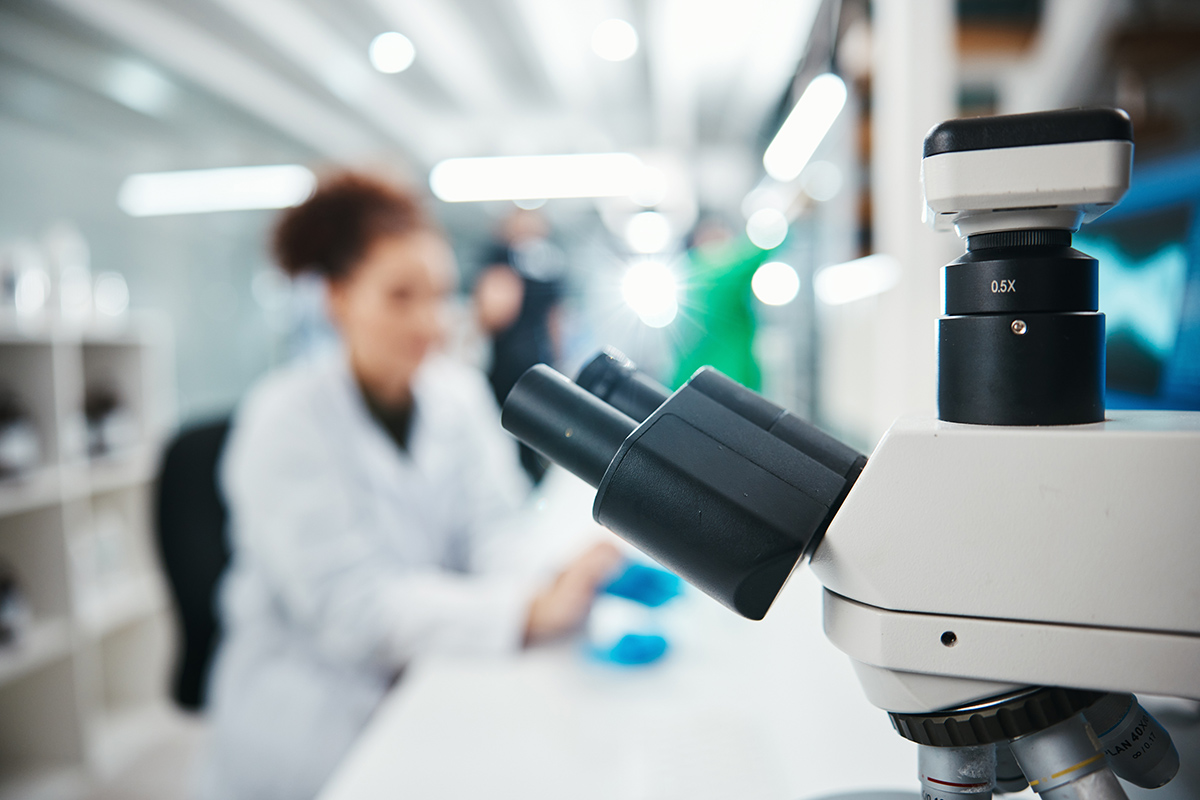 A microscope on a desk.