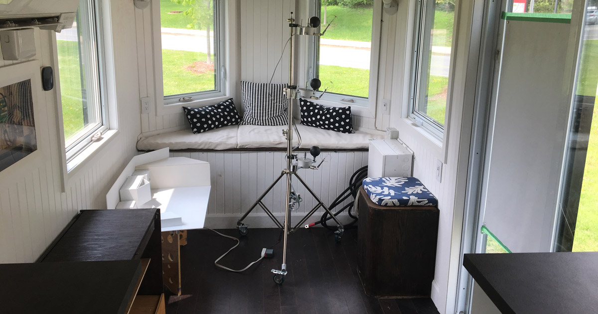 An indoor view of the Northern Nomad tiny house with equipment set up to research the lifespan of Vacuum Insulation Panels.