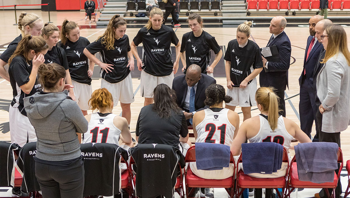 Women in Sport: The Ravens women's basketball team gathers around coach Taffe Charles