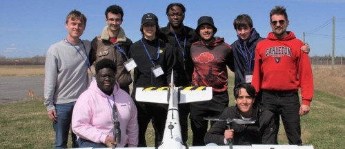 A winning team from a National Student Drone Competition pose for a group shot.