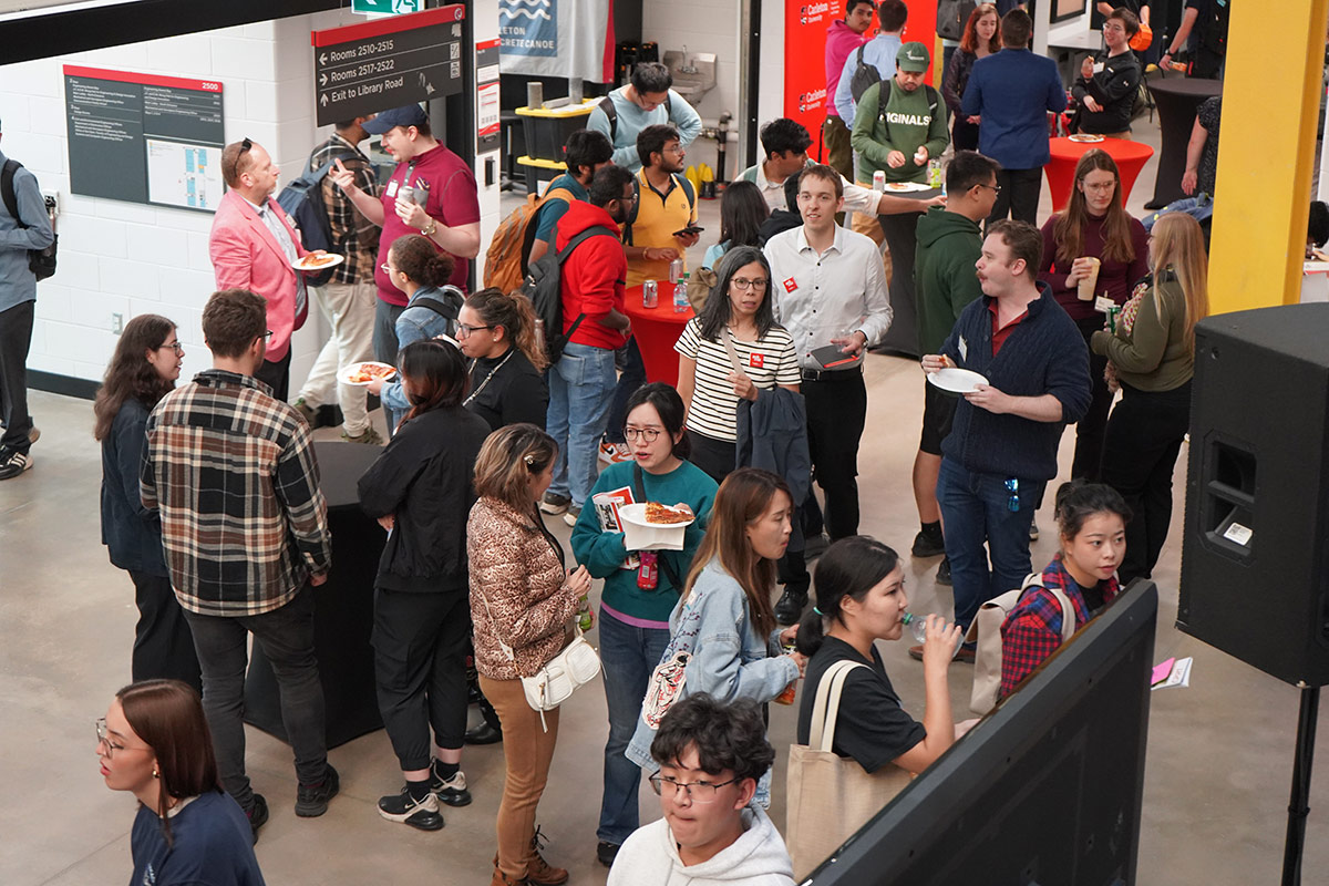 An aerial view of people interacting at a networking event.