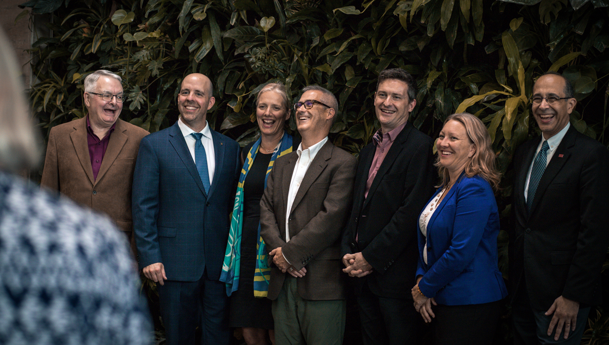 Government and university officials pose during the announcement of Transport Canada funding for Carleton research projects.